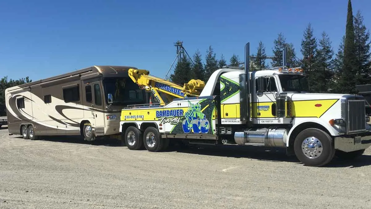 Motor home towed by a Bambauer extended reach wrecker