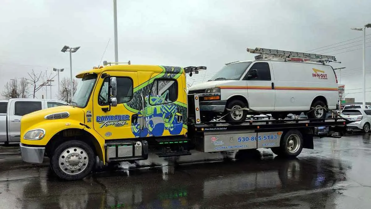 Bambauer flatbed with a van on Interstate 5